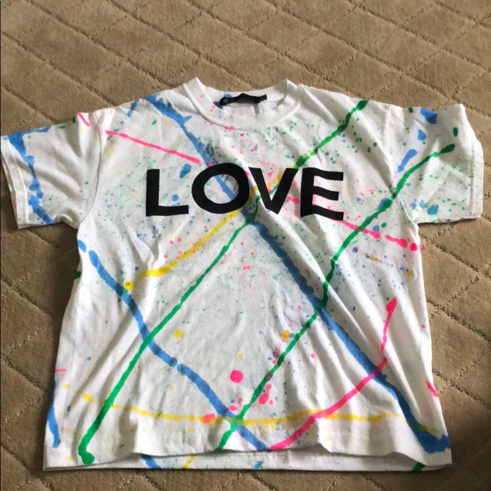 T-shirt brand new. Splatter paint with word love.